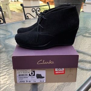 Clark’s black wedge lace ups.